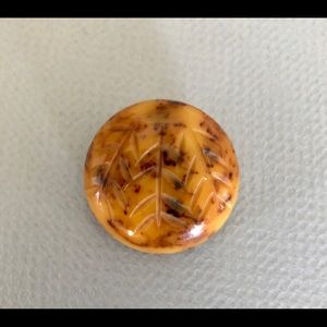 Carved Bakelite leaves round brooch